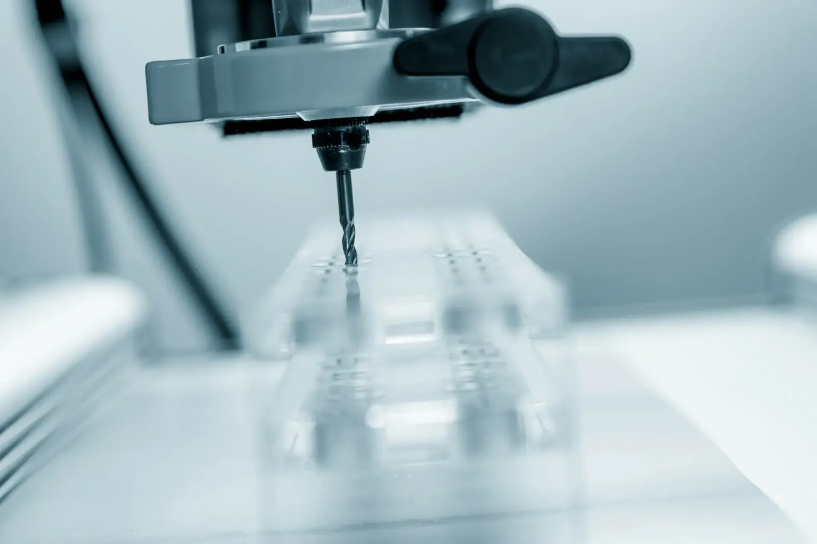 Milling cutter machining a transparent plastic sheet